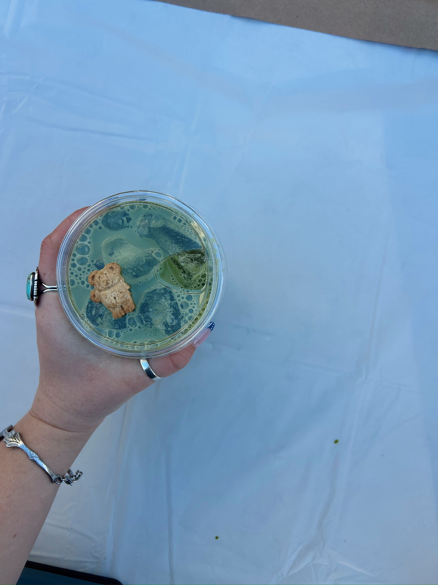 A playful matcha drink with a bear-shaped cookie, part of Jessie's new photography direction